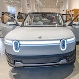Sabrina Eijan takes a photograph of the new Rivian R2 prototype that will eventually be made in Georgia at the Ponce City Market in Atlanta on April 27, 2024. (Steve Schaefer/AJC)