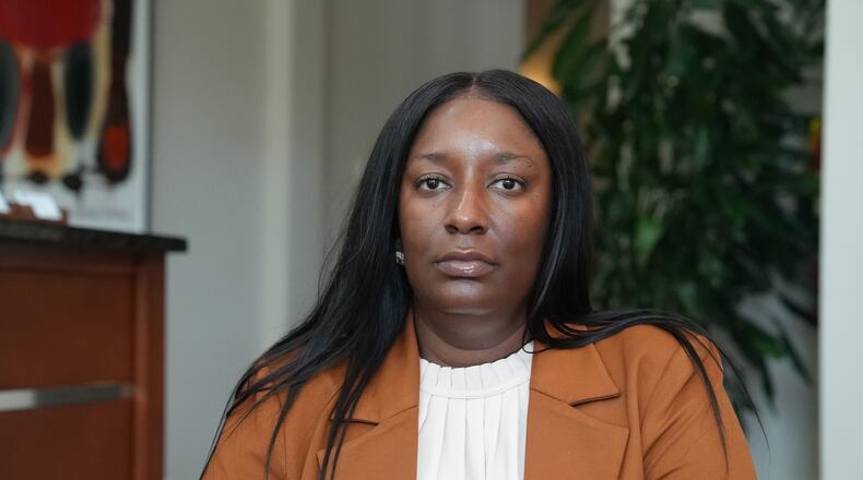 Cassandra Barksdale, who says she was wrongly diagnosed with cancer due to a tissue labelling mistake, poses at her attorney's office in Atlanta, Ga., Thursday, Aug. 6, 2026. (AP Photo/Emilie Megnien)