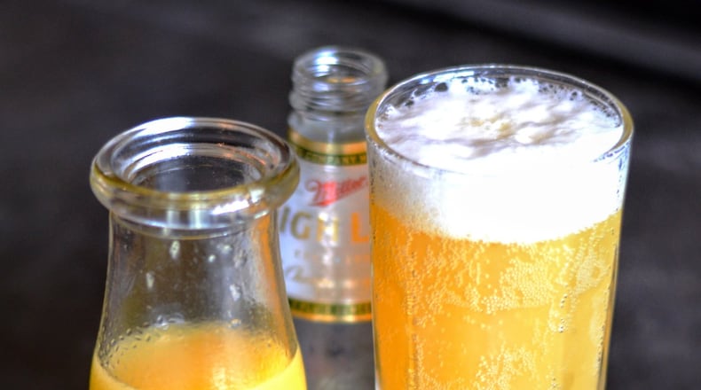 The redneck mimosa, a staple on One Eared Stag’s brunch menu, is made with fresh squeezed orange juice and Miller High Life. (Henri Hollis)