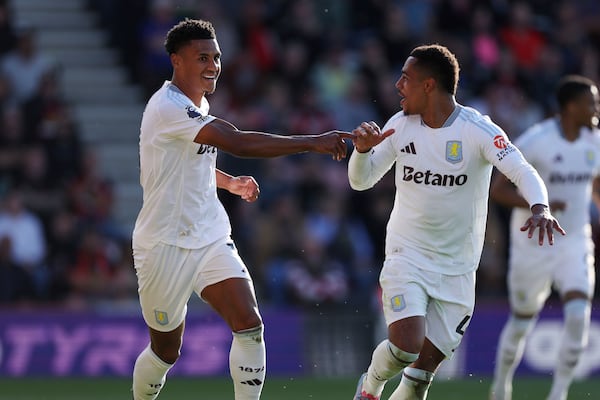 Aston Villa's Ollie Watkins, left, celebrates scoring with Jacob Ramsey during the English Premier League soccer match between Bournemouth and Aston Villa at the Vitality Stadium, Bournemouth, England, Saturday May 10, 2025. (Steven Paston/PA via AP)
