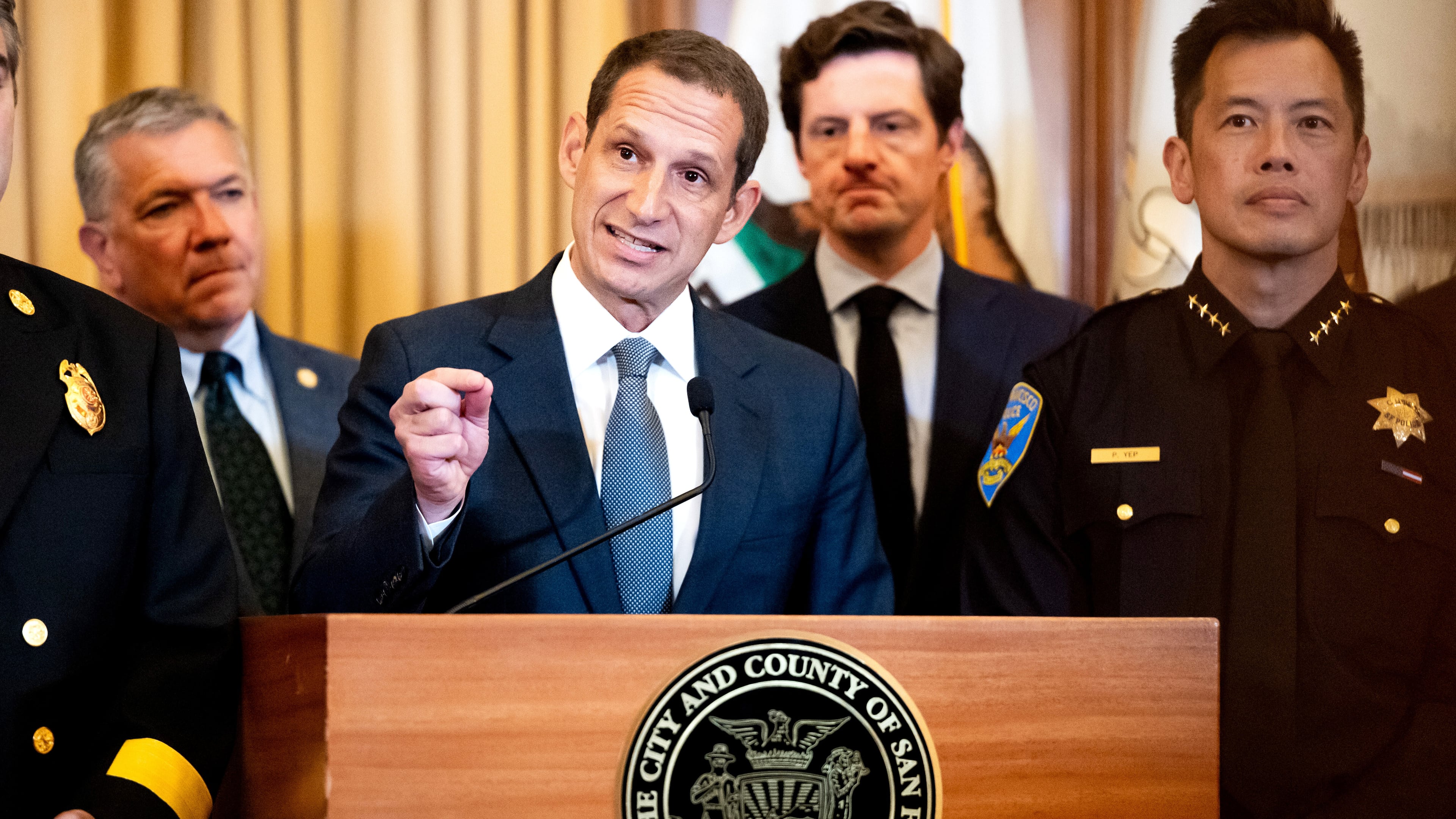 Flanked by city leaders, San Francisco Mayor Daniel Lurie discusses President Donald Trump's comments that he has called off a surge of federal law enforcement in San Francisco on Thursday, Oct. 23, 2025, in San Francisco. (AP Photo/Noah Berger)