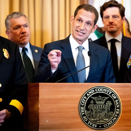 Flanked by city leaders, San Francisco Mayor Daniel Lurie discusses President Donald Trump's comments that he has called off a surge of federal law enforcement in San Francisco on Thursday, Oct. 23, 2025, in San Francisco. (AP Photo/Noah Berger)