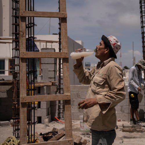 FILE - Jorge Moreno, a worker, drinks flavored water to cope with the heat wave during his workday at a construction site in Veracruz, Mexico, on June 17, 2024. (AP Photo/Felix Marquez, File)