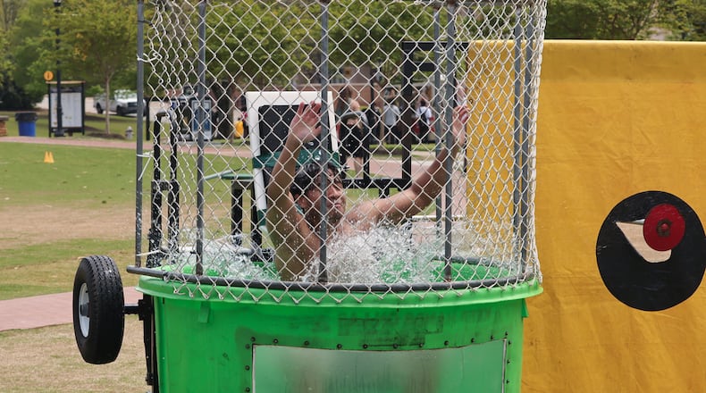 Jason Manzanarez, a junior business management major at Kennesaw State University, takes the plunge during Pi Kappa Phi's "Dunk-a-Brother" event.