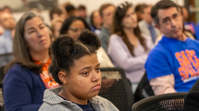 Kiley King, an 11th grader who attended Parklane Elementary School in East Point reacts to the Fulton County Board of Education’s vote to close the elementary school on Thursday, Feb 20, 2025. Parents, teachers, students and community members filled the public comment time asking to keep Parklane and Spalding Drive elementary schools open. (Jenni Girtman for The Atlanta Journal-Constitution)
