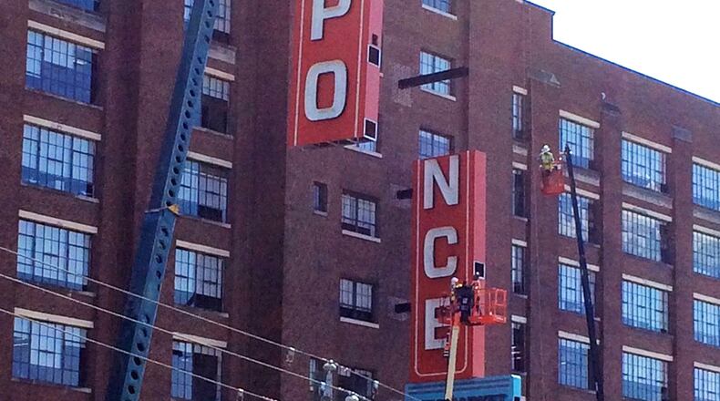 The sign goes up for Ponce City Market, the former Sears building on Ponce de Leon Avenue in Atlanta that s being renovated into new office, retail and restaurant space.