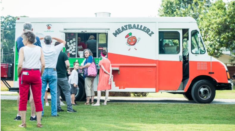 Customers line up outside the Meatballerz truck.