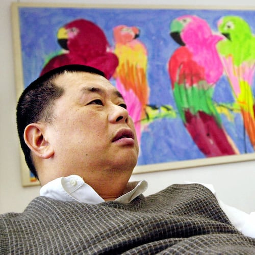 FILE - Hong Kong publisher Jimmy Lai speaks in his Hong Kong office at the Apple Daily newspaper, Nov. 28, 2000. (AP Photo/Vincent Yu, File)