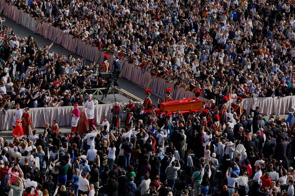The body of Pope Francis is carried through St. Peter's Square to St. Peter's Basilica at the Vatican, Wednesday, April 23, 2025, where he will lie in state for three days. (Cecilia Fabiano/ Lapresse via AP)