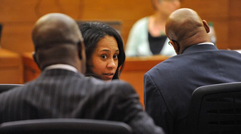 Prosecutor Fani Willis turns to talk with Fulton County DA Paul Howard during witness statements. Sentencing of 10 of the 11 defendants convicted of racketeering and other charges in the Atlanta Public Schools test-cheating trial before Judge Jerry Baxter in Fulton County Superior Court, Monday April 13 2015. (Atlanta Journal-Constitution, Kent D. Johnson, Pool)