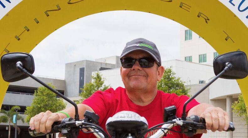 Matt Schneider of Alpharetta is making a cross-country trek on his mobility scooter to raise awareness about the need for organ donations. CONTRIBUTED