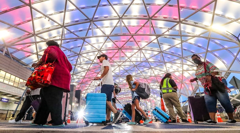 July 5, 2022 Hartsfield-Jackson International Airport: Airline travelers on the North Domestic Terminal made their way through Hartsfield-Jackson International Airport at the domestic terminal on Tuesday, July 5, 2022 after managing through a busy Fourth of July weekend for air travel with storms and cancellations, airlines face the challenge of navigating through the rest of a busy summer. Pilot unions, travelers and Atlanta-based Delta Air Lines had raised concerns about staffing issues and flight disruptions over the holiday weekend. Delta ended up canceling dozens of flights a day throughout the weekend, as did other major carriers as thunderstorms hit Georgia and the East coast. But the Independence Day weekend flight cancellations werenÕt as severe as during Memorial Day weekend and some other nightmare travel days so far this summer. On Friday, the busiest day of the holiday weekend, Delta canceled 117 flights, or 3.9% of scheduled flights according to FlightAware.com. On Saturday, it canceled 81 flights, followed by 54 cancellations on Sunday and 41 cancellations on Monday. Fort Worth, Texas-based American Airlines and Delta have had the worst cancellation rates in the U.S. airline industry in recent weeks, according to FlightAware.com data. (John Spink / John.Spink@ajc.com)