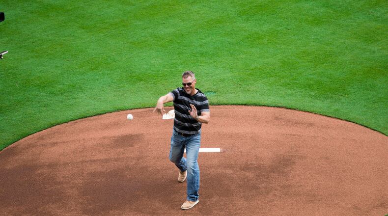 03/29/2018 -- Atlanta, GA - Baseball Hall of Fame inductee and former Atlanta Braves player Chipper Jones throws the ceremonial first pitch for the Atlanta Braves season opener game at SunTrust Park, Thursday, March 29, 2018. ALYSSA POINTER/ALYSSA.POINTER@AJC.COM