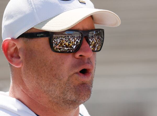 Head coach Brent Key speaks to players after Georgia Tech's annual White and Gold game in Atlanta on Saturday, April 12, 2025. Key is 18-16 as coach of the Yellow Jackets. (Bob Andres/AJC)