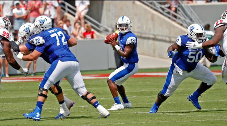 North Carolina State's Thayer Thomas (87) hauls in a pass against Georgia State's DeAndre Applin (24) during the first half of an NCAA college football game in Raleigh, N.C., Saturday, Sept. 8, 2018. (AP Photo/Chris Seward)