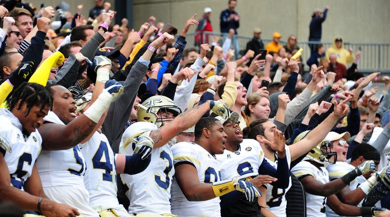 ATLANTA, GA - NOVEMBER 11: Members of the Georgia Tech Yellow Jackets celebrate with fans after the game against the Virginia Tech Hokies on November 11, 2017 at Bobby Dodd Stadium in Atlanta, Georgia. (Photo by Scott Cunningham/Getty Images)