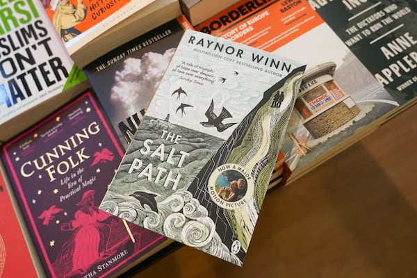 A copy of "The Salt Path", by Raynor Winn is on display in a book store, in London, Friday, July 11, 2025. (AP Photo/Alberto Pezzali)