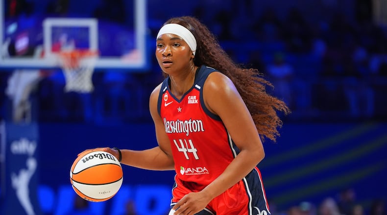 FILE - Washington Mystics forward Kiki Iriafen dribbles during the first half of a WNBA basketball game against the Dallas Wings in Arlington, Texas, May 18, 2026. (AP Photo/LM Otero, File)