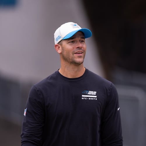 Carolina Panthers head coach Dave Canales walks up to the field forc} the NFL football team's training camp Friday, July 24, 2026, in Charlotte, N.C. (AP Photo/Scott Kinser)