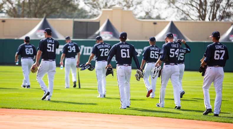 Hi-ho, hi-ho, it's off to work the Braves pitchers and catchers go Wednesday, the first day of spring training. (AP Photo/Willie J. Allen Jr.)
