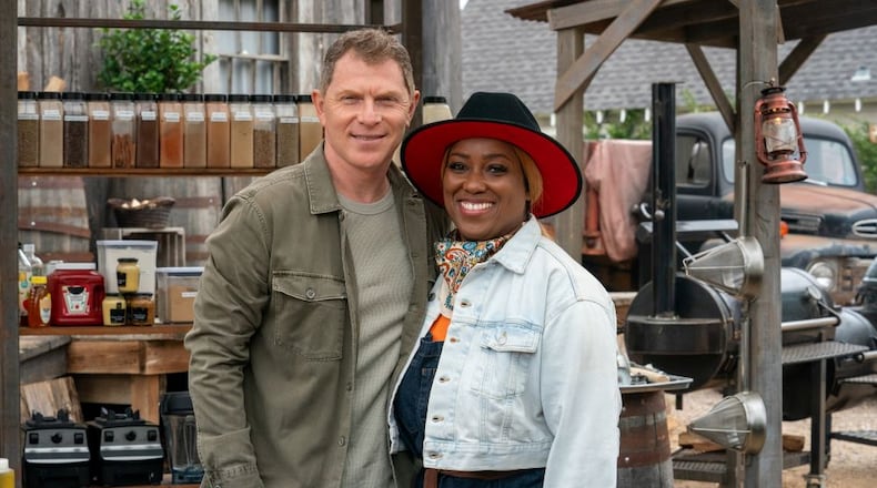 Chef Erica Barrett (r.) wins Master of Que crown on season five of the Food Network cooking competition series 'BBQ Brawl' created by restaurateur and television personality Bobby Flay (l.)