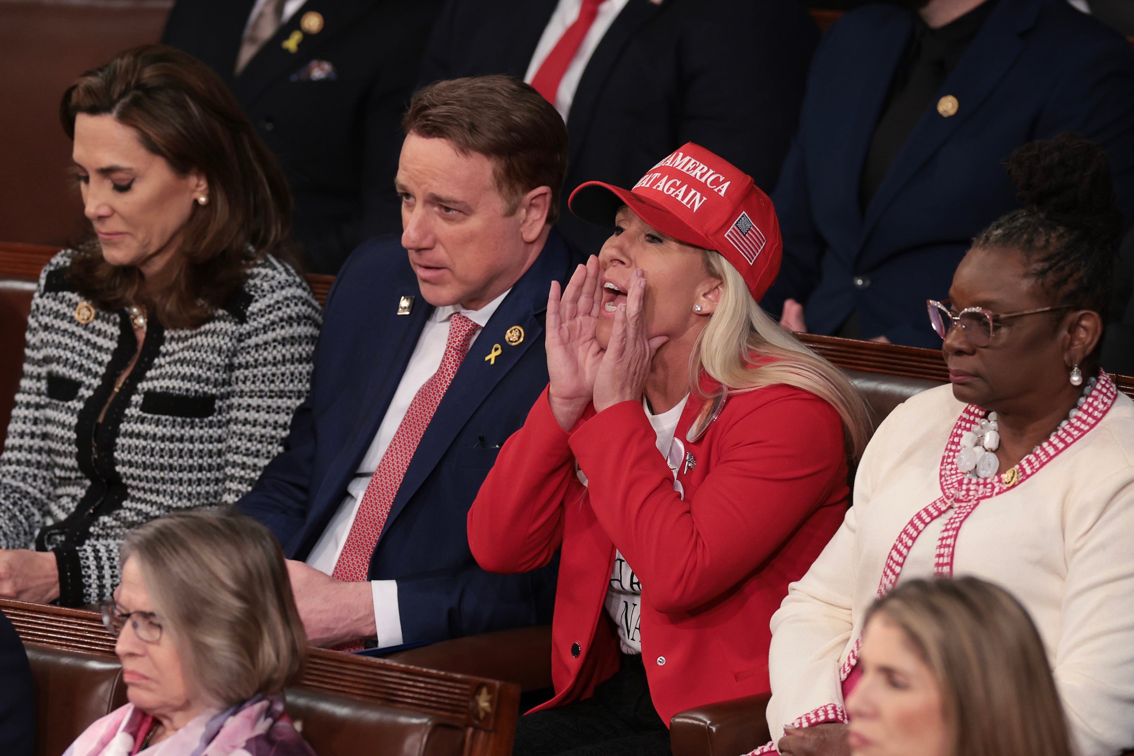 U.S. Rep. Marjorie Taylor Greene (R-GA) calls out as President Joe Biden delivers the State of the Union address during a joint meeting of Congress in the House chamber at the U.S. Capitol on Thursday, March 7, 2024, in Washington, D.C. (Win McNamee/Getty Images/TNS)