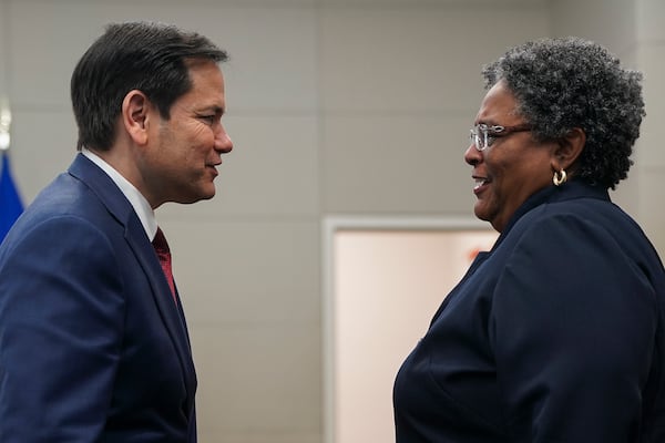 U.S. Secretary of State Marco Rubio, left, meets with Barbados Prime Minister Mia Mottley at the U.S. Embassy in Kingston, Jamaica, Wednesday, March 26, 2025. (Nathan Howard/Pool Photo via AP)