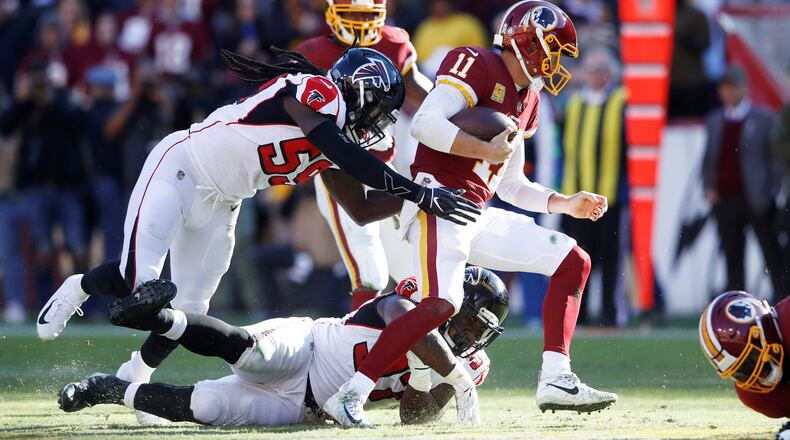 Falcons’ De'Vondre Campbell (59) and Grady Jarrett chase Washington quarterback Alex Smith in the second quarter Sunday, Nov. 4, 2018, at FedExField  in Landover, Md. Atlanta won 38-14.