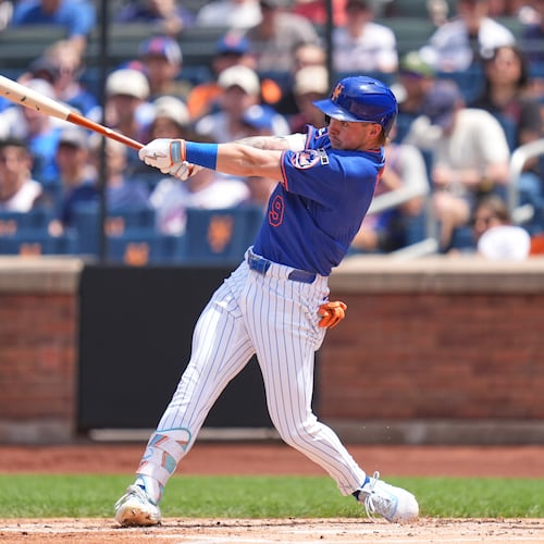 New York Mets' A.J. Ewing hits a two-run double during the first inning of a baseball game against the Atlanta Braves, Sunday, June 14, 2026, in New York. (AP Photo/Seth Wenig)