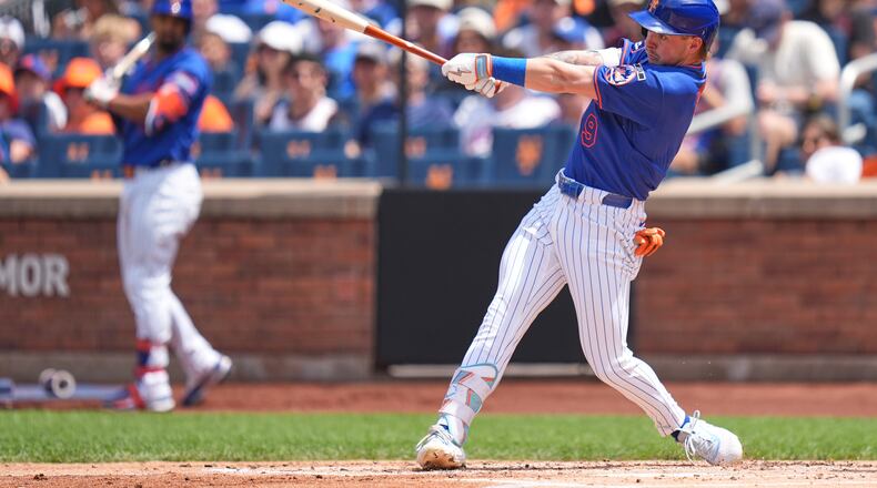 New York Mets' A.J. Ewing hits a two-run double during the first inning of a baseball game against the Atlanta Braves, Sunday, June 14, 2026, in New York. (AP Photo/Seth Wenig)