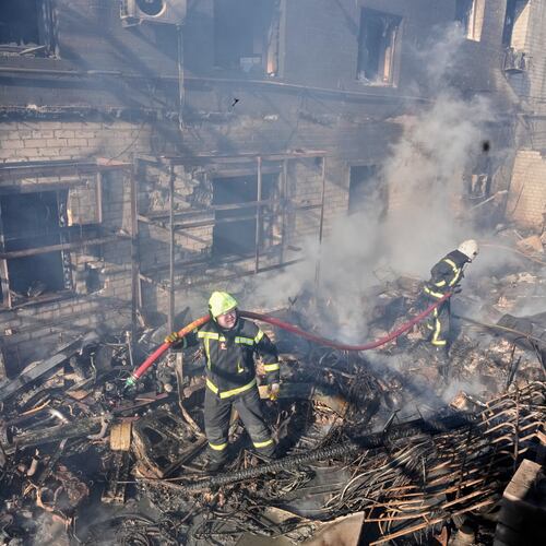 Firefighters put out the fire at a residential neighbourhood following a Russia missile and drone attack, in Brovary, close to Kyiv, Ukraine, Saturday, March 14, 2026. (AP Photo/Efrem Lukatsky)