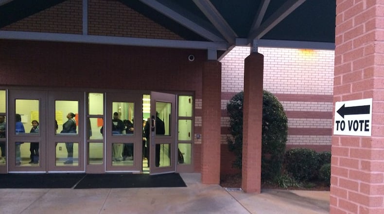 Voters who arrived at John Wesley Dobbs Elementary School before the polls opened at 7 a.m. were spared from having to stand outside in the cold.  (BECCA GODWIN / BECCA.GODWIN@AJC.COM)
