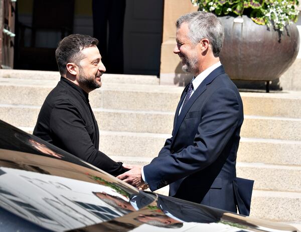 Denmark's King Frederik, right, receives Ukraine's President Volodymyr Zelenskyy as he arrives at Marselisborg Castle on the occasion of Denmark taking over the EU presidency, in Aarhus, Denmark, Thursday, July 3, 2025. (Henning Bagger/Ritzau Scanpix via AP)