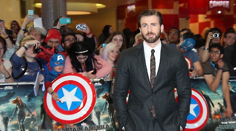 Chris Evans poses for photographers as he arrives for the UK premiere of the movie Captain America: The Winter Soldier at the Vue Westfield on Thursday, March 20, 2014 in London. (Photo by Joel Ryan/Invision/AP Images)