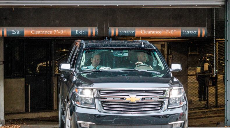 Gov. Brian Kemp, in a vehicle, leaves the Fulton County Courthouse in Atlanta on Tuesday, November 15, 2022, where he testified before a grand jury examining whether former President Donald Trump and his allies criminally meddled in Georgia’s 2020 elections. (Arvin Temkar / arvin.temkar@ajc.com)