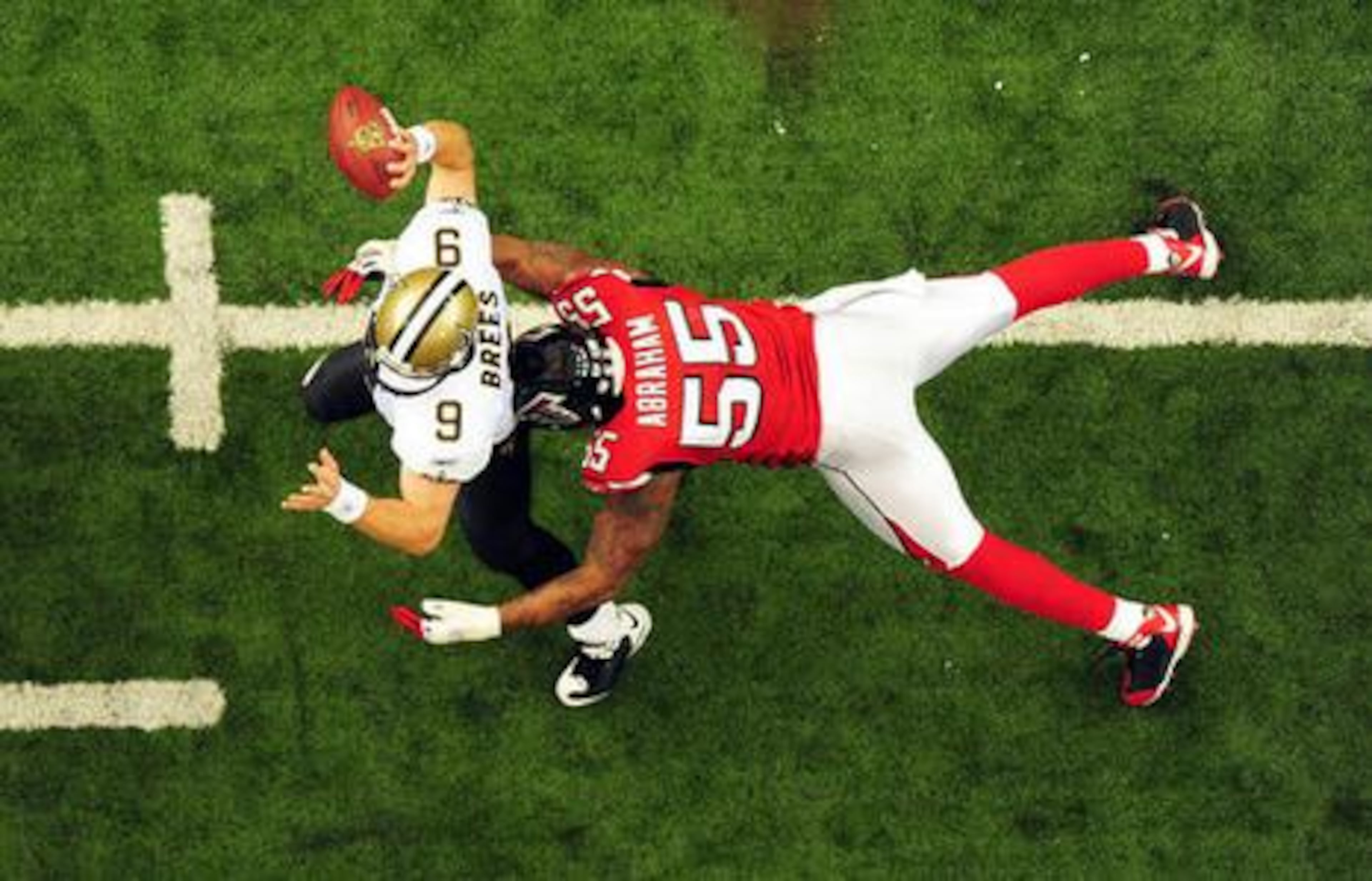 Does John Abraham (right) belong in the Hall of Fame? Abraham, who anchored the Falcons' defense on former coach Mike Smith’s four playoff teams, advanced to the top 50 in the Pro Football Hall of Fame voting for the Class of 2025. (AJC 2008)