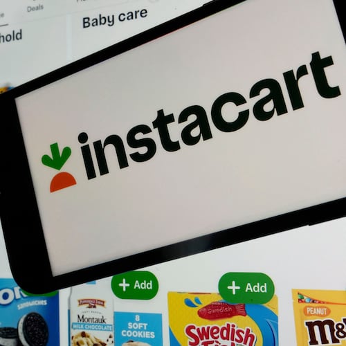FILE - An instacart logo and an instacart webpage are shown in this photo, in New York, on Sept. 6, 2023. (AP Photo/Richard Drew, File)