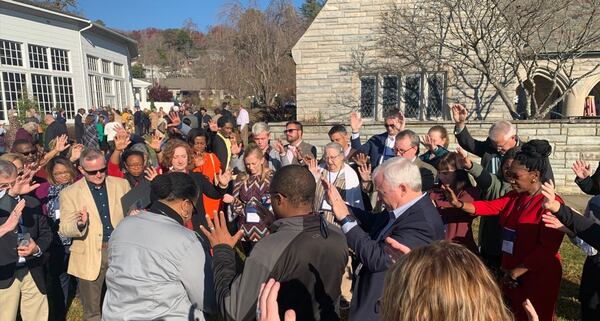 Friends and members of the North Georgia Conference  surrounded Bishop Dease in prayer and welcome. after the assignment was announced,