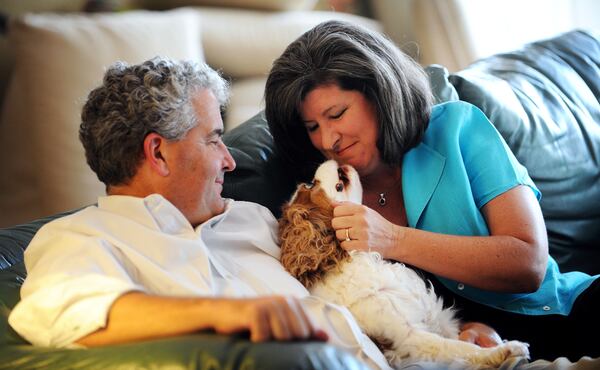 In this September 2012 photo, Karen Handel is seen at her Roswell home with Mia, her Cavalier King Charles Spaniel, and husband, Steve, who she describes as "a prince among men."  BITA HONARVAR / BHONARVAR@AJC.COM