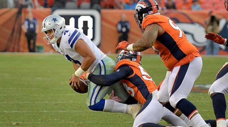 Dallas Cowboys quarterback Dak Prescott (4) is sacked by Denver Broncos outside linebacker Von Miller (58) during the fourth quarter as the Denver Broncos beat the Dallas Cowboys 42-17 on Sunday, Sept. 17, 2017 at Sports Authority Field at Mile High in Denver, Colo. (Max Faulkner/Fort Worth Star-Telegram/TNS)