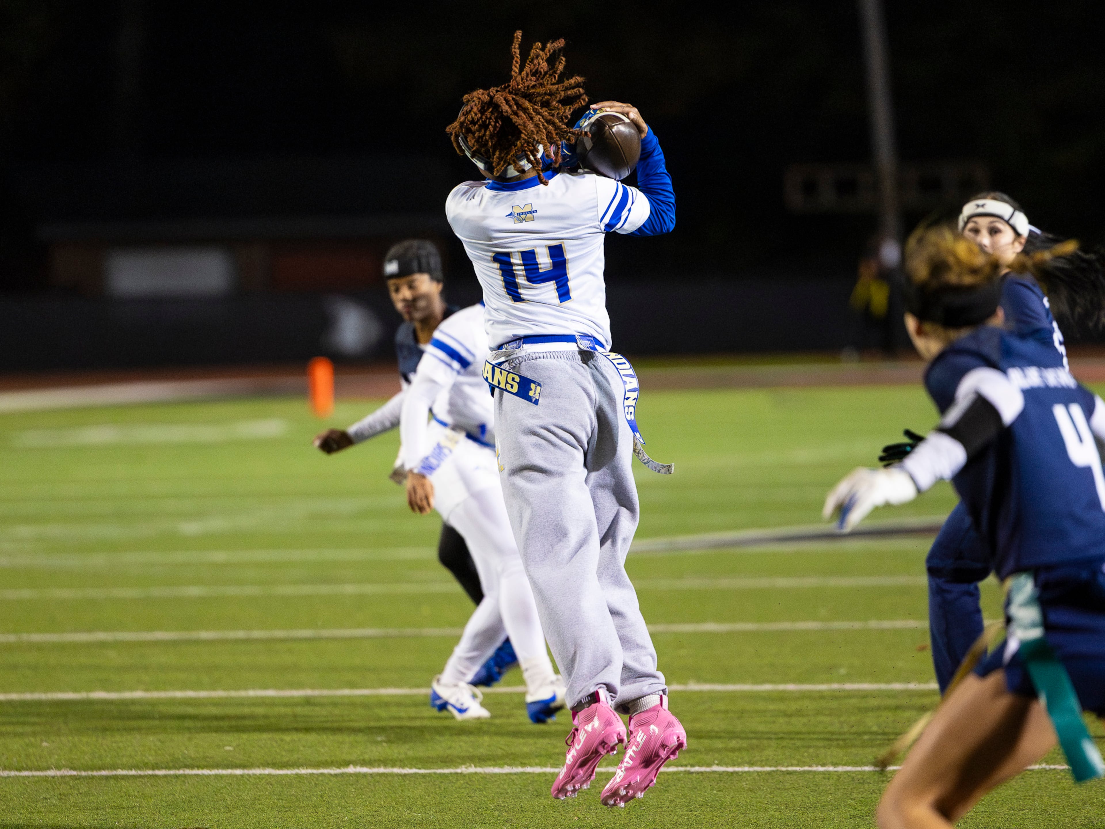 McEachern linebacker Saniyah Dickens (14) catches the ball in a flag football game against Marietta at Osborne High School in Marietta, GA on Monday, November 17th, 2025. (Oscar Guevara Saenz for the AJC)