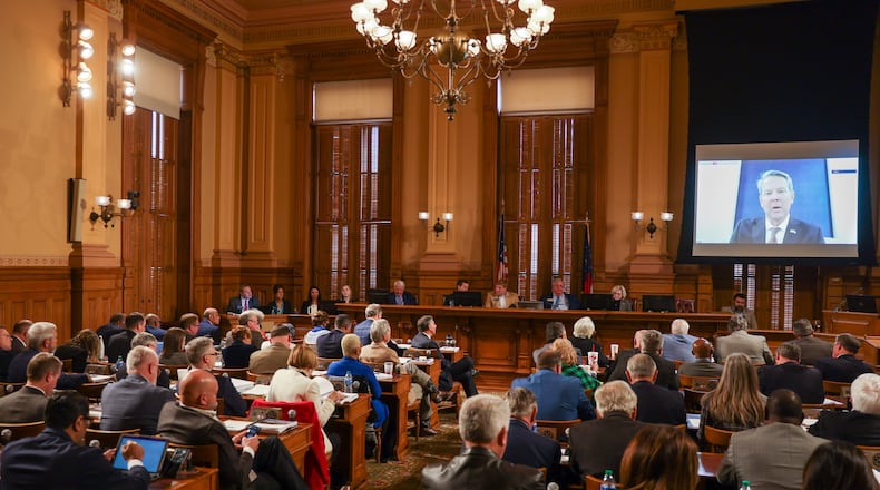 Members of the legislature listen to Gov. Brian Kemp (on screen) at the start on budget hearings in Atlanta on Tuesday, January 17, 2023.   (Arvin Temkar/The Atlanta Journal-Constitution)