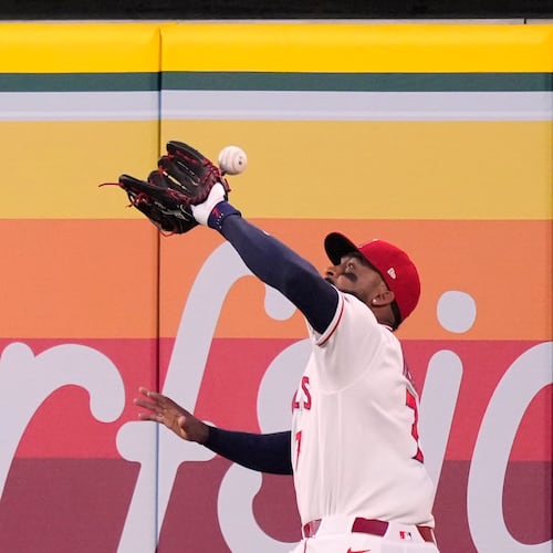 Los Angeles Angels right fielder Jo Adell misplays a ball hit by Colorado Rockies' TJ Rumfield that hit him in the head and then bounced out for a solo home run during the fourth inning of a baseball game Tuesday, June 2, 2026, in Anaheim, Calif. (AP Photo/Mark J. Terrill)