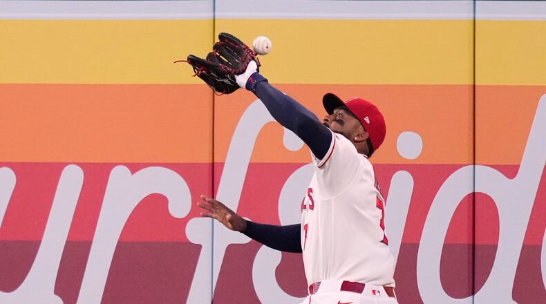 Los Angeles Angels right fielder Jo Adell misplays a ball hit by Colorado Rockies' TJ Rumfield that hit him in the head and then bounced out for a solo home run during the fourth inning of a baseball game Tuesday, June 2, 2026, in Anaheim, Calif. (AP Photo/Mark J. Terrill)