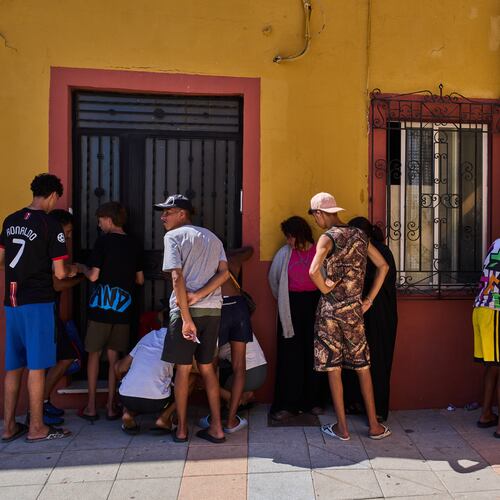 Migrants, some of them unaccompanied minors, who crossed from Morocco into Spain, write down their contact information to give to a neighborhood association in the Spanish enclave of Ceuta, Tuesday, Aug. 4, 2026. (AP Photo/Bernat Armangue)