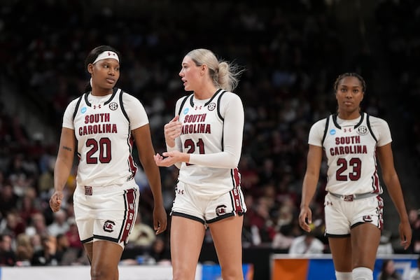 South Carolina forward Sania Feagin (20), South Carolina forward Chloe Kitts (21) and South Carolina guard Bree Hall (23) enter the court during the second half in the first round of the NCAA college basketball tournament, Friday, March 21, 2025, in Columbia, S.C. (AP Photo/David Yeazell)