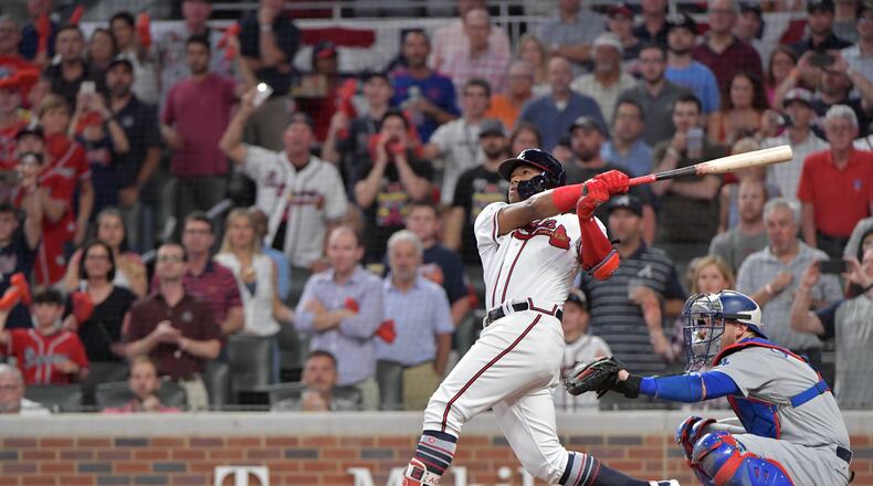 The Braves’ Ronald Acuna hits a grand slam  in the second inning of Game 3 of the National League Division Series against the Dodgers.