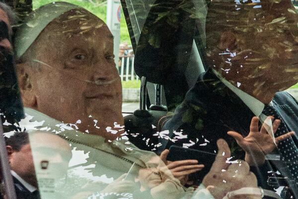 Pope Francis leaves on a car after appearing at a window of the Agostino Gemelli Polyclinic in Rome, Sunday, March 23, 2025, where he has been treated for bronchitis and bilateral pneumonia since Feb. 14. (AP Photo/Stefano Costantino)
