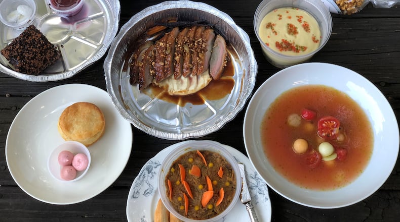 Lazy Betty’s $95 takeout tasting menu includes five courses plus duck (center), Georgia shrimp causa (right); cantaloupe gazpacho, lacquered biscuit with raspberry butter, pistachio and chocolate cake roulade and (upper right) petit fours and caramel-bourbon-pecan popcorn. Wendell Brock for The Atlanta Journal-Constitution