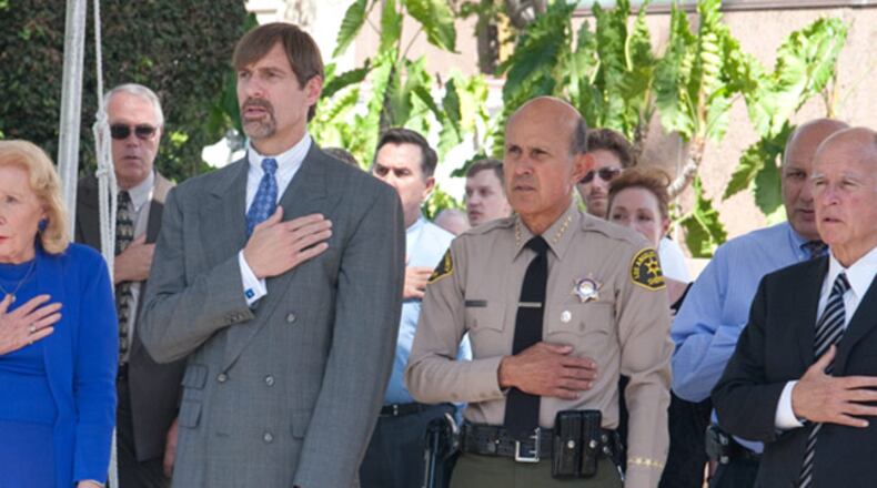 Henry Nicholas, second from the left, co-founded a group to strengthen the rights of crime victims.